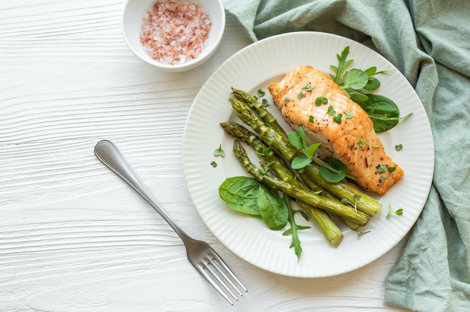 Baked Delicious salmon, green asparagus on plate